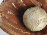 Beaten-Up Baseball in Baseball Glove Photographic Print