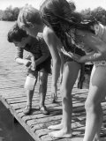 Group of Children Fishing from a Jetty Photographie