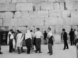 Jewish Men in Various Modes of Traditional Dress at the Wailing Wall in Jerusalem Lámina fotográfica