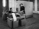 Man and a Women Working Together with a Pegasus Computer Fotografie-Druck