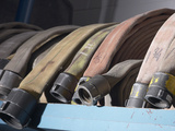 Row of Fire Hoses Photographic Print