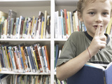 Quiet Little Boy Reading Library Book Fotografie-Druck