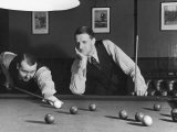 Snooker Player Prepares to Play a Shot as His Partner Looks On Fotografie-Druck