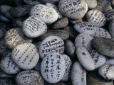 Prayer on Stones at the Feet of a Buddha (Senyu-Ji), Japan Fotografisk tryk Prayer on Stones at the Feet of a Buddha (Senyu-Ji), Japan Fotografisk tryk