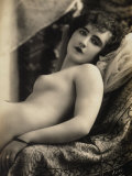 A Young Woman Posing Nude on a Couch Photographic Print