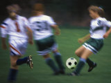 Girls Playing Soccer on a Field Photographic Print