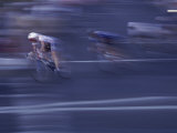 Speeding Cyclists Photographic Print