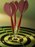 Close-up of Three Darts in the Bull's-Eye of a Dartboard Photographic Print