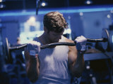 Young Man Exercising with Barbells Photographic Print
