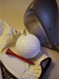 Golf Ball Near a Tee with a Glove and a Golf Club Photographic Print