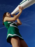 Low Angle View of a Cheerleader Holding a Bullhorn Photographic Print