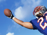 Low Angle View of An American Football Player Catching a Ball Fotografie-Druck