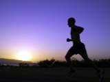 Silhouette of a Man Running Fotografie-Druck