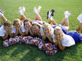 High Angle View of Cheerleaders Lying on a Lawn Photographic Print