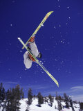 Low Angle View of a Skier in Mid Air Photographic Print