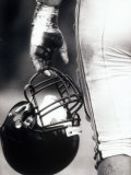 Low Angle View of An American Football Player Holding a Helmet Photographic Print