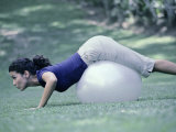 Side Profile of a Young Woman Exercising on a Fitness Ball Photographic Print