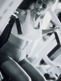 Young Woman Working Out in a Health Club Photographie