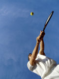 Tennis Player with Blue Sky Photographic Print