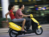 Young Couple Riding on a Motor Scooter Photographic Print