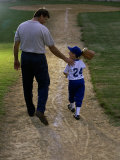 Rear View of a Man Walking with His Son at a Playing Field Photographic Print