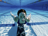 Woman Swimming Underwater in a Swimming Pool Photographic Print