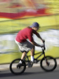 Moving Bicycle and Rider Photographic Print