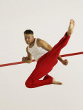 Young Man Kicking While Practicing Karate Photographic Print