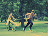 Man Pulling Woman on a Bicycle Photographie