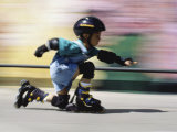 Boy on Rollerblades Crouching Photographic Print