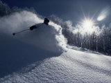 Skier in a Cloud of Snow with Sunburst Photographic Print