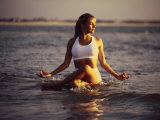Young Woman Meditating at the Beach Photographic Print