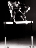 Portrait of a Young Man Jumping over a Hurdle Photographic Print