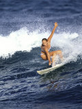 Female Surfer Riding a Wave Photographic Print