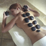 Young Woman Lying Down Undergoing Lastone Therapy Photographic Print