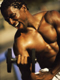 Young Man Exercising with a Dumbbell Photographic Print