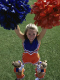 High Angle View of Cheerleaders Performing with Pom-Poms Photographic Print