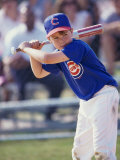 Boy Swinging a Baseball Bat on a Field Photographic Print
