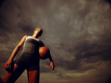Low Angle View of a Young Woman Holding a Basketball Lámina fotográfica
