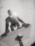 Low Angle View of a Young Man on a Diving Board Photographic Print