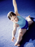 High Angle View of a Female Gymnast Stretching Photographic Print