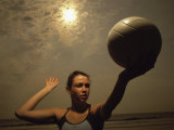 Young Woman Playing Beach Volleyball Photographic Print