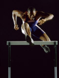 Portrait of a Young Man Jumping over a Hurdle Lámina fotográfica