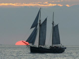 A Sailing Ship Sails During Sunset Towards the Harbor of Bremerhaven Photographic Print