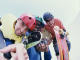Low Angle View of a Group of Young Men Holding Skateboards Lámina fotográfica Low Angle View of a Group of Young Men Holding Skateboards Lámina fotográfica