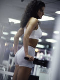 Side Profile of a Young Woman Exercising in a Gym Photographic Print