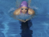 High Angle View of a Young Woman Swimming the Breaststroke in a Swimming Pool Photographic Print