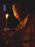 Pope John Paul II Prays Before a Candle at the Beginning of an Holy Easter Vigil Mass Photographic Print