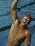 High Angle View of a Male Swimmer Raising His Hands in the Air Photographic Print