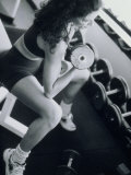 Young Woman Exercising with Dumbbells Photographic Print